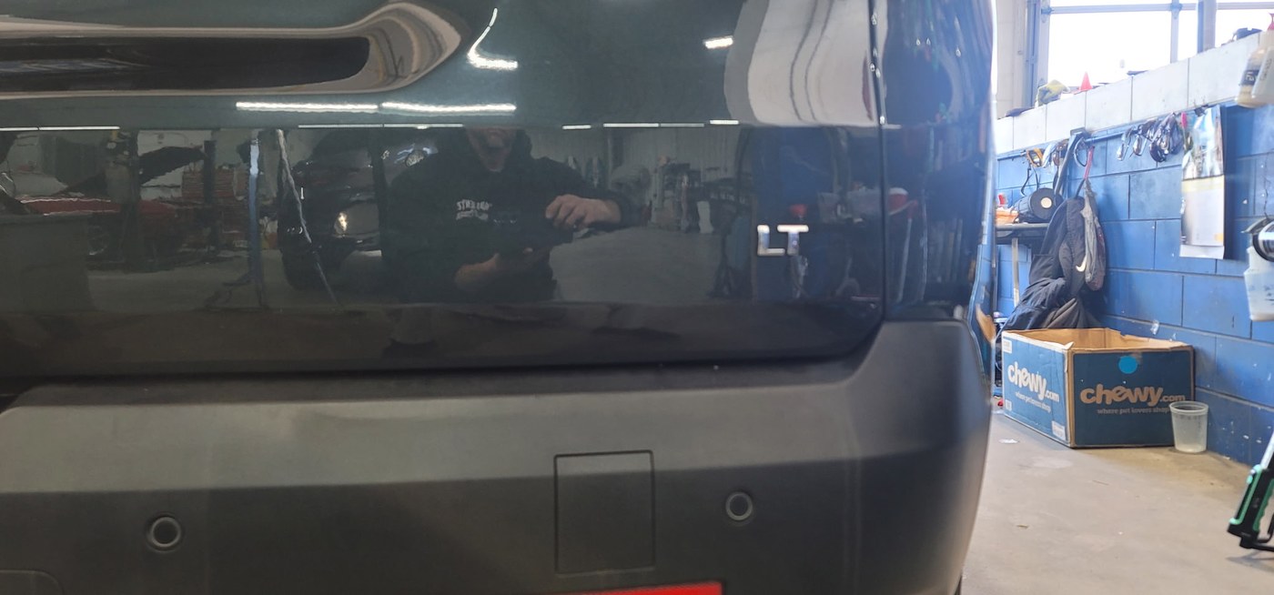 Chevy Equinox rear quarter panel restored to smooth factory finish by Apex Hail and Dent paintless dent repair