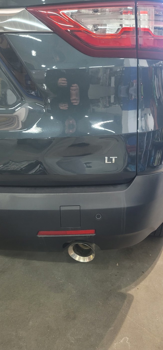 Chevy Equinox rear quarter panel with dent visible before paintless dent repair