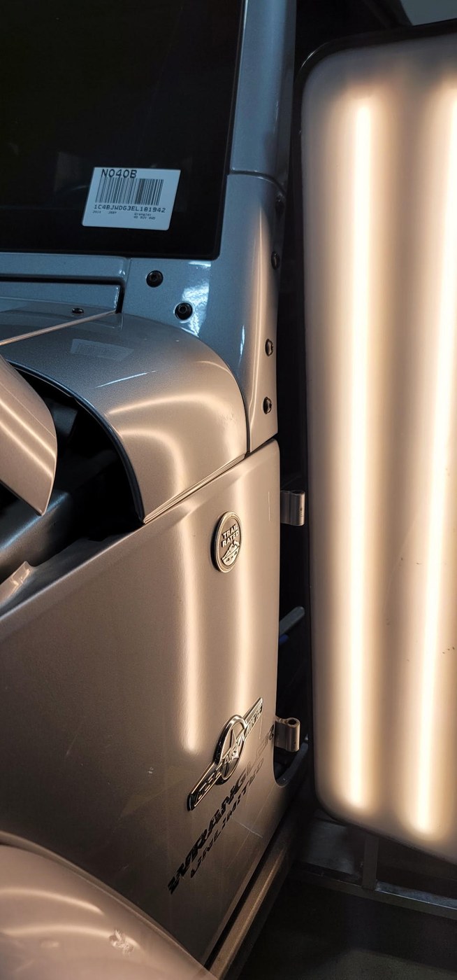 Jeep Wrangler door panel after Apex paintless dent repair — factory contour restored